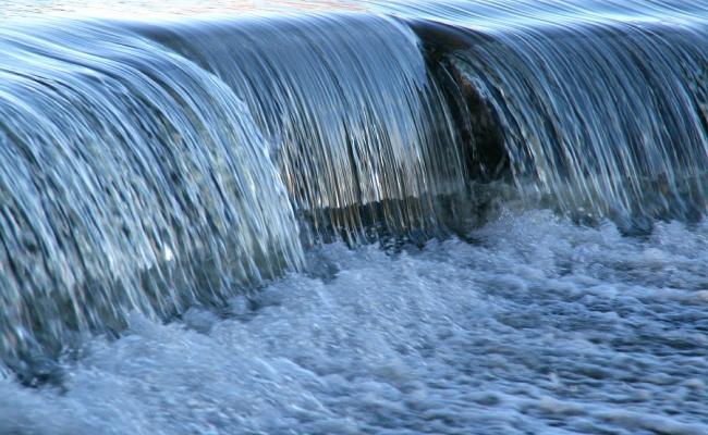 Water flowing over dam